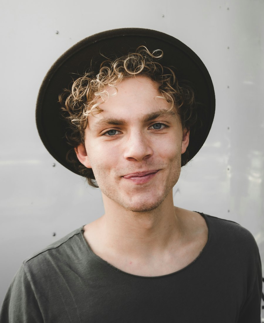 A man in a hat, photographed in daylight